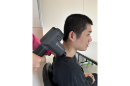 Treating the back of the neck muscles with hypervolt